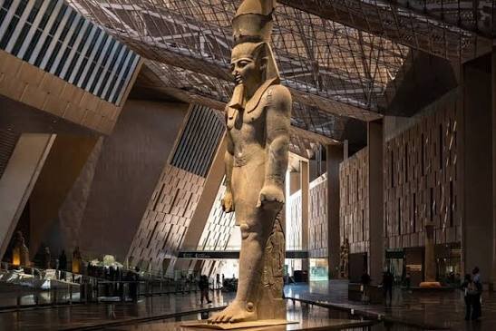 Colossal statue of Ramesses II in the atrium of the Grand Egyptian Museum