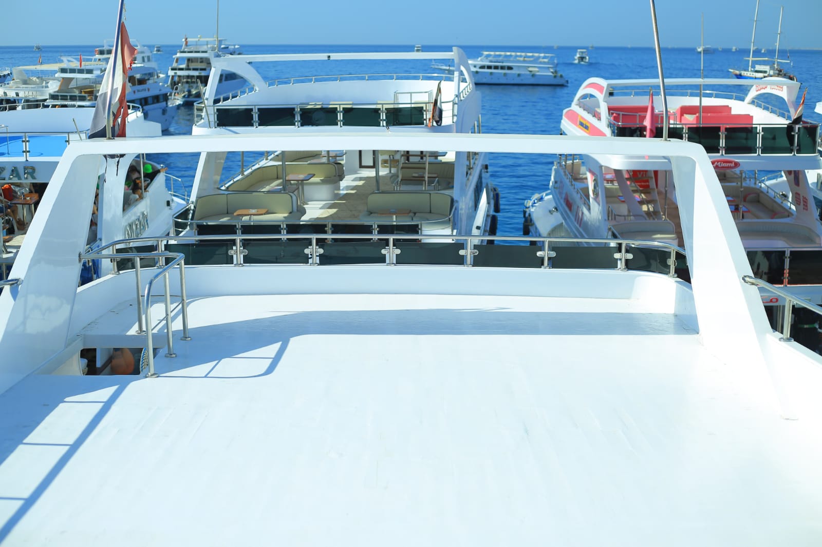 Boat deck view with Red Sea and other vessels in background